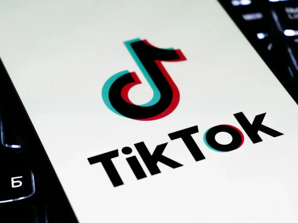 Young adults using TikTok on smartphones to access news content