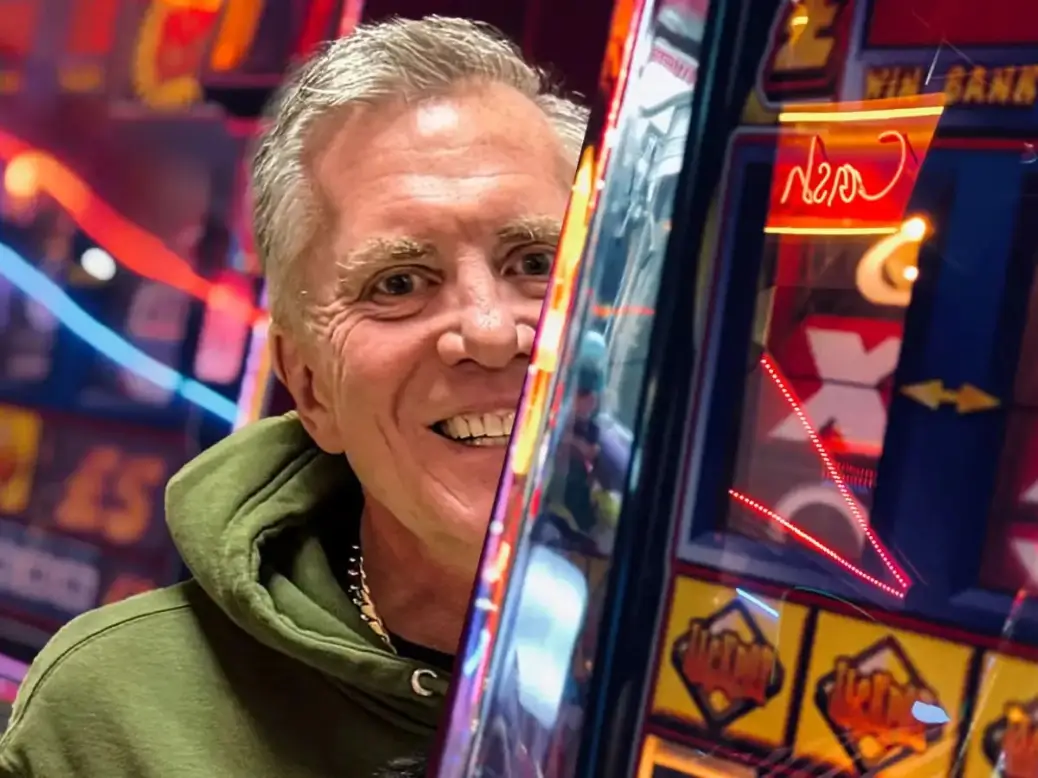 Vegas Matt posing in front of a casino, exuding confidence and luxury, representing his high-stakes gambling lifestyle.