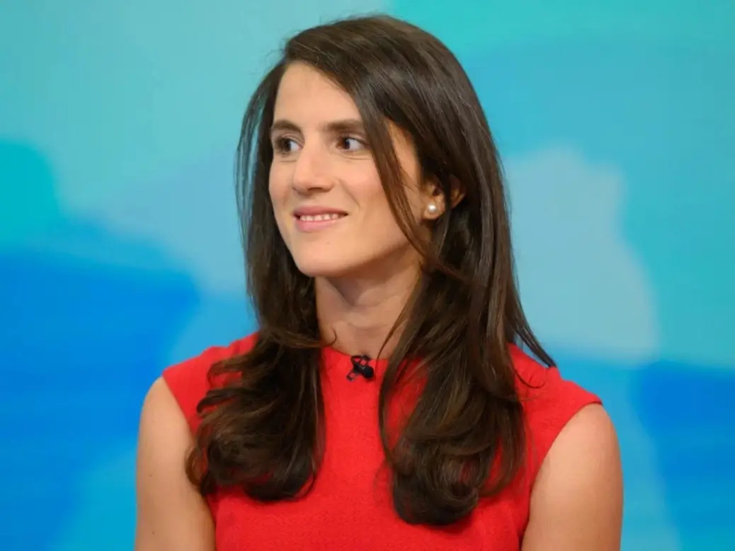 Tatiana Schlossberg speaking at an event with a calm and composed presence